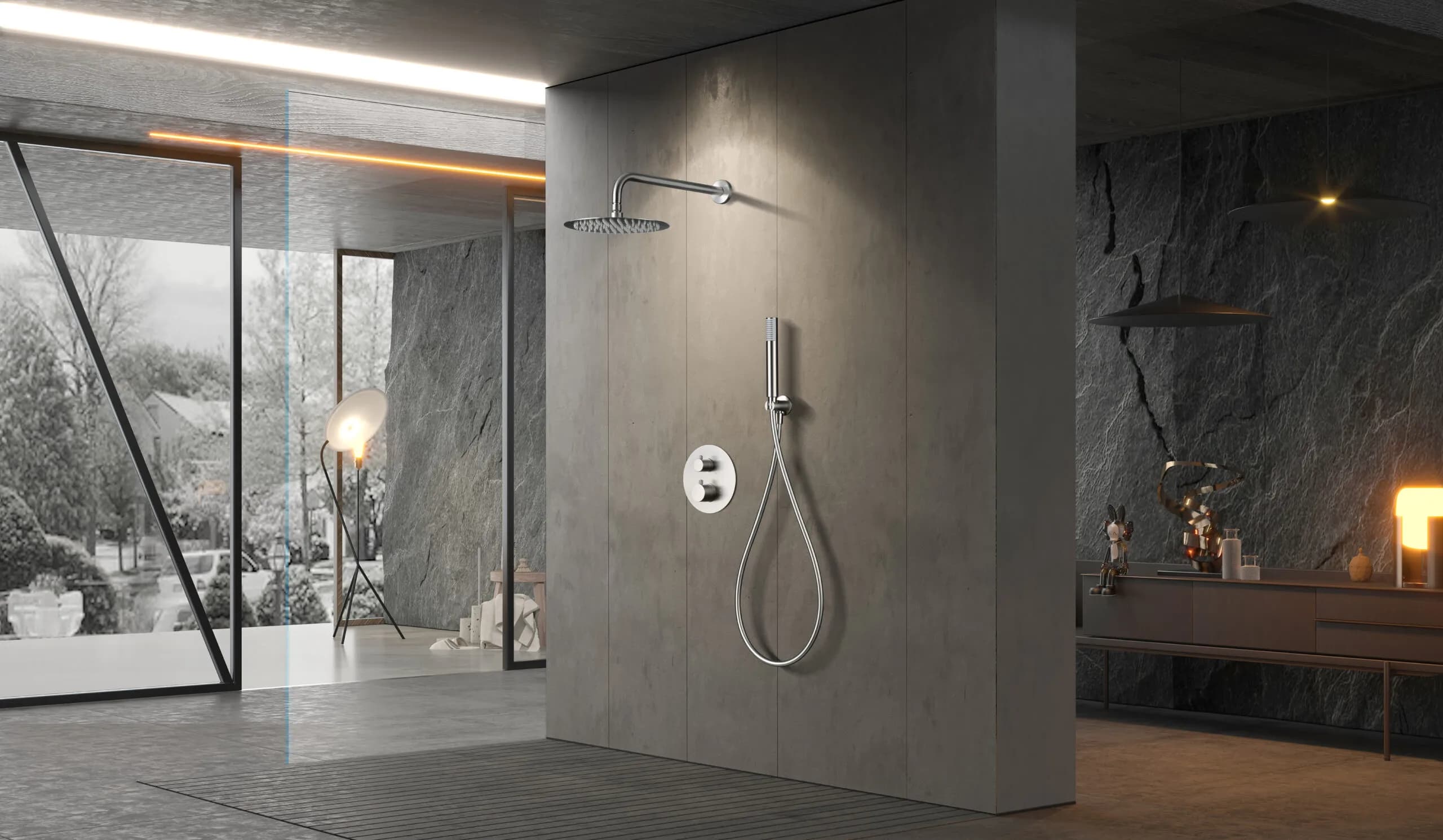 Modern shower installed on a gray stone bathroom wall in a spacious, minimalist area with warm lighting and an exterior view.